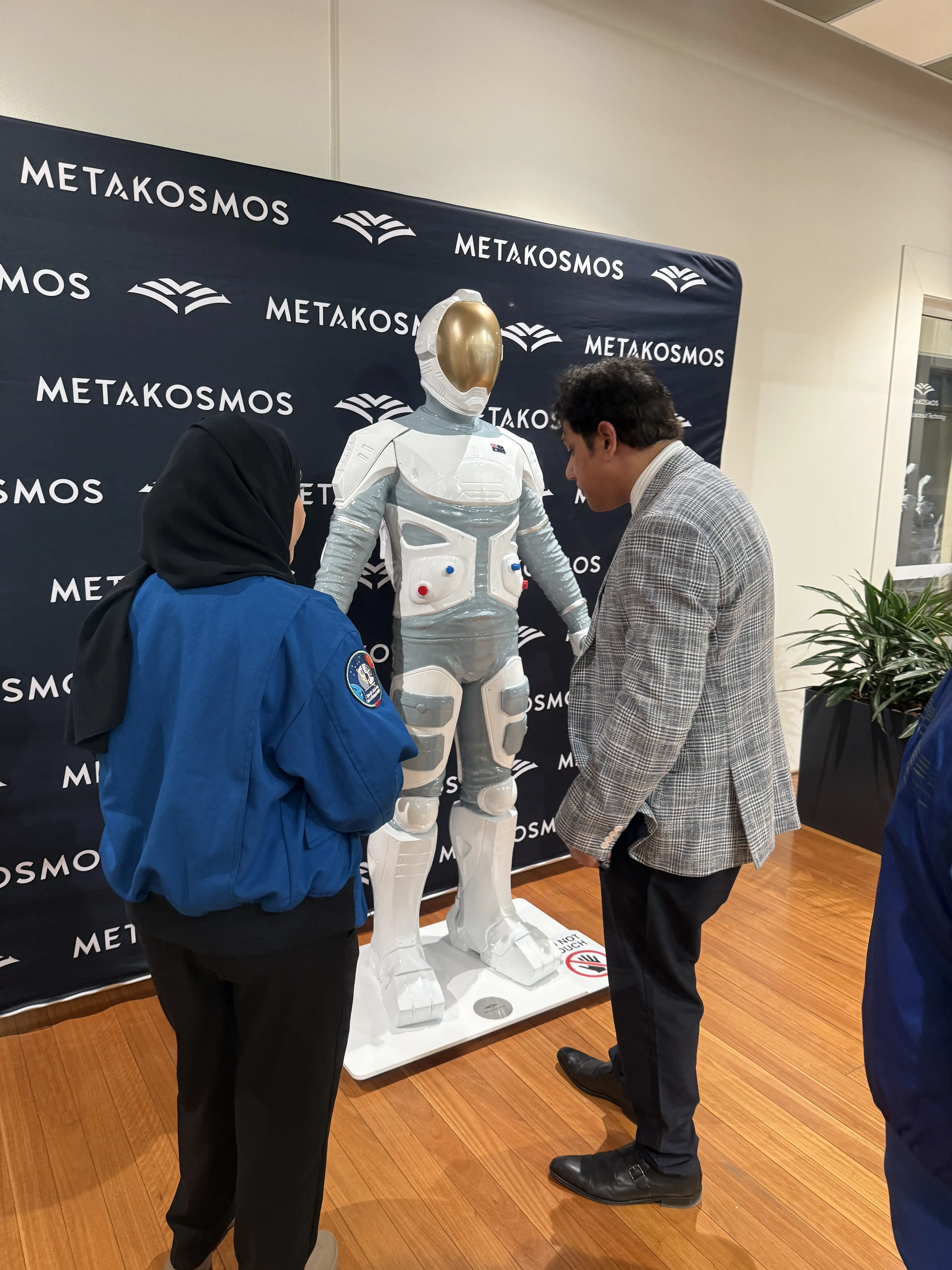 International astronauts touring the Metakosmos human systems laboratory during IAC 2025